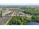 Breathtaking aerial perspective of a community situated among picturesque lakes and vibrant foliage at 7235 Sharpsburg Blvd, New Port Richey, FL 34653