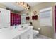 Bright bathroom with white vanity, large mirror, and red plaid shower curtain at 7235 Sharpsburg Blvd, New Port Richey, FL 34653