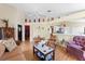 Inviting living room features vaulted ceilings, wood floors, and an open layout, perfect for entertaining guests and relaxing at 7235 Sharpsburg Blvd, New Port Richey, FL 34653