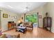 Comfortable living room with hardwood floors, vaulted ceilings, neutral tones, and sliding glass doors leading to the lanai at 7235 Sharpsburg Blvd, New Port Richey, FL 34653