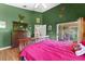 Spacious main bedroom features vaulted ceilings, access to the patio, and a view of the backyard at 7235 Sharpsburg Blvd, New Port Richey, FL 34653