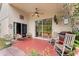 Covered patio with outdoor seating, ceiling fan, and sliding glass doors at 7235 Sharpsburg Blvd, New Port Richey, FL 34653