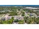 A scenic aerial view of a residential community with tree-lined streets and well-kept properties at 7285 Nightwalker Rd, Weeki Wachee, FL 34613