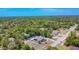 Aerial view of a home surrounded by lush greenery, showcasing its location and proximity to nature at 7285 Nightwalker Rd, Weeki Wachee, FL 34613