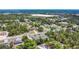 A scenic aerial view of a residential community with tree-lined streets and well-kept properties at 7285 Nightwalker Rd, Weeki Wachee, FL 34613