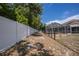 Backyard perimeter with a white vinyl fence and a chain link fence that provides an excellent pet run at 7285 Nightwalker Rd, Weeki Wachee, FL 34613