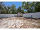 Fenced backyard with a storage shed, providing additional space for outdoor equipment and storage needs at 7285 Nightwalker Rd, Weeki Wachee, FL 34613