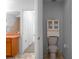 Small bathroom features toilet and vanity with tile floor at 7285 Nightwalker Rd, Weeki Wachee, FL 34613