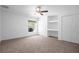 Bright bedroom with a ceiling fan, carpet, and built in desk and closet space at 7285 Nightwalker Rd, Weeki Wachee, FL 34613