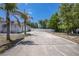 Long driveway leads to the home's three-car garage, providing ample parking space and curb appeal at 7285 Nightwalker Rd, Weeki Wachee, FL 34613
