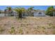 Well-maintained home with an attractive facade and front yard, showcasing its curb appeal and landscaping potential at 7285 Nightwalker Rd, Weeki Wachee, FL 34613