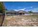 View of backyard with a caged pool, offering a great space for summer fun at 7285 Nightwalker Rd, Weeki Wachee, FL 34613