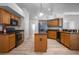 Kitchen features an island with built in outlets and stainless steel appliances at 7285 Nightwalker Rd, Weeki Wachee, FL 34613
