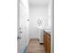 Laundry room featuring a window, washer and dryer, and cabinets with counter space at 7285 Nightwalker Rd, Weeki Wachee, FL 34613