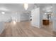 Spacious living room with wood floors and an open concept to the kitchen at 7285 Nightwalker Rd, Weeki Wachee, FL 34613