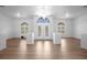 Elegant living room boasts laminate wood flooring, decorative lighting, and lots of space at 7285 Nightwalker Rd, Weeki Wachee, FL 34613