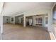 Expansive covered patio with ceiling fans, tiki bar, and views of the pool at 7285 Nightwalker Rd, Weeki Wachee, FL 34613