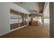 Spacious covered patio with stamped concrete floor and thatched bar, with a view of the pool at 7285 Nightwalker Rd, Weeki Wachee, FL 34613