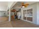 Spacious covered patio with stamped concrete floor and thatched bar, with a view of the pool and lawn at 7285 Nightwalker Rd, Weeki Wachee, FL 34613