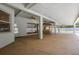 Spacious covered patio with a stamped concrete floor, bar, and view of the pool at 7285 Nightwalker Rd, Weeki Wachee, FL 34613