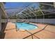 Sparkling pool and patio area surrounded by a screened enclosure, perfect for outdoor enjoyment at 7285 Nightwalker Rd, Weeki Wachee, FL 34613