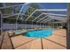 Sparkling pool with attached spa and screened enclosure, perfect for outdoor entertaining and relaxation at 7285 Nightwalker Rd, Weeki Wachee, FL 34613