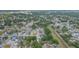 A peaceful neighborhood setting showcasing green landscapes and residential streets from above at 7903 Heather Ct, Tampa, FL 33634