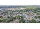 Expansive aerial view capturing a residential area with diverse rooftops, tree coverage, and neighborhood streets at 7903 Heather Ct, Tampa, FL 33634