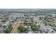 A high-angle view shows a neighborhood with mature landscaping near a drainage canal at 7903 Heather Ct, Tampa, FL 33634