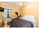 Bedroom showcasing ample natural light, a peloton, and plush bedding at 7903 Heather Ct, Tampa, FL 33634