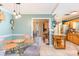 View of the dining area and kitchen featuring modern lighting, stainless appliances, and an island at 7903 Heather Ct, Tampa, FL 33634