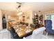 Spacious dining room with a wet bar, wine storage, and an extra long wooden table with formal seating at 7903 Heather Ct, Tampa, FL 33634