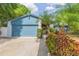 Charming single-story home with a well-kept lawn, mature landscaping, and a welcoming entrance at 7903 Heather Ct, Tampa, FL 33634