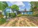 Charming single-story home featuring a well-maintained lawn and manicured shrubbery along the walkway at 7903 Heather Ct, Tampa, FL 33634