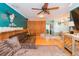 Spacious living room with hardwood floors, wood paneling and a large comfortable sectional sofa at 7903 Heather Ct, Tampa, FL 33634