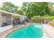 Inviting backyard pool and patio area complete with comfortable seating, great for enjoying sunny days and evenings at 7903 Heather Ct, Tampa, FL 33634