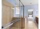 Enclosed glass shower stall with view of a soaking tub and double sink vanity at 7911 Hampton Lake Dr, Tampa, FL 33647