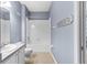 Clean bathroom with shower-tub combination and vanity with granite countertop at 7911 Hampton Lake Dr, Tampa, FL 33647