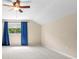 Spacious bedroom with a large window, neutral paint, and plush carpeting at 7911 Hampton Lake Dr, Tampa, FL 33647