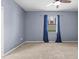 This cozy bedroom is bright, and features a ceiling fan and a large window at 7911 Hampton Lake Dr, Tampa, FL 33647