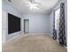 Large bedroom with neutral carpet, walk-in closet, and lots of natural light at 7911 Hampton Lake Dr, Tampa, FL 33647