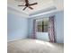 Spacious bedroom featuring a ceiling fan and carpeted floors, providing a comfortable and inviting atmosphere at 7911 Hampton Lake Dr, Tampa, FL 33647