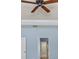 Bedroom featuring a ceiling fan and showing the doorway leading into the bathroom at 7911 Hampton Lake Dr, Tampa, FL 33647