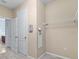 Walk-in closet with shelving and showing the doorway leading to an adjacent room at 7911 Hampton Lake Dr, Tampa, FL 33647