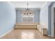 Dining area with large bay window, built-in seating, and tile flooring at 7911 Hampton Lake Dr, Tampa, FL 33647