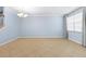 Spacious dining area with tile floors, neutral walls, and a large window for natural light at 7911 Hampton Lake Dr, Tampa, FL 33647
