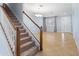 Open entryway with staircase, tile floors, and view of the living room featuring natural light at 7911 Hampton Lake Dr, Tampa, FL 33647
