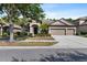 Charming single-story home with a well-manicured lawn and a three-car garage at 7911 Hampton Lake Dr, Tampa, FL 33647