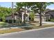Inviting single-story home with a well-kept lawn, lush landscaping, and a spacious three-car garage at 7911 Hampton Lake Dr, Tampa, FL 33647
