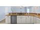 Kitchen with granite countertops, stainless steel appliances, and white cabinetry at 7911 Hampton Lake Dr, Tampa, FL 33647